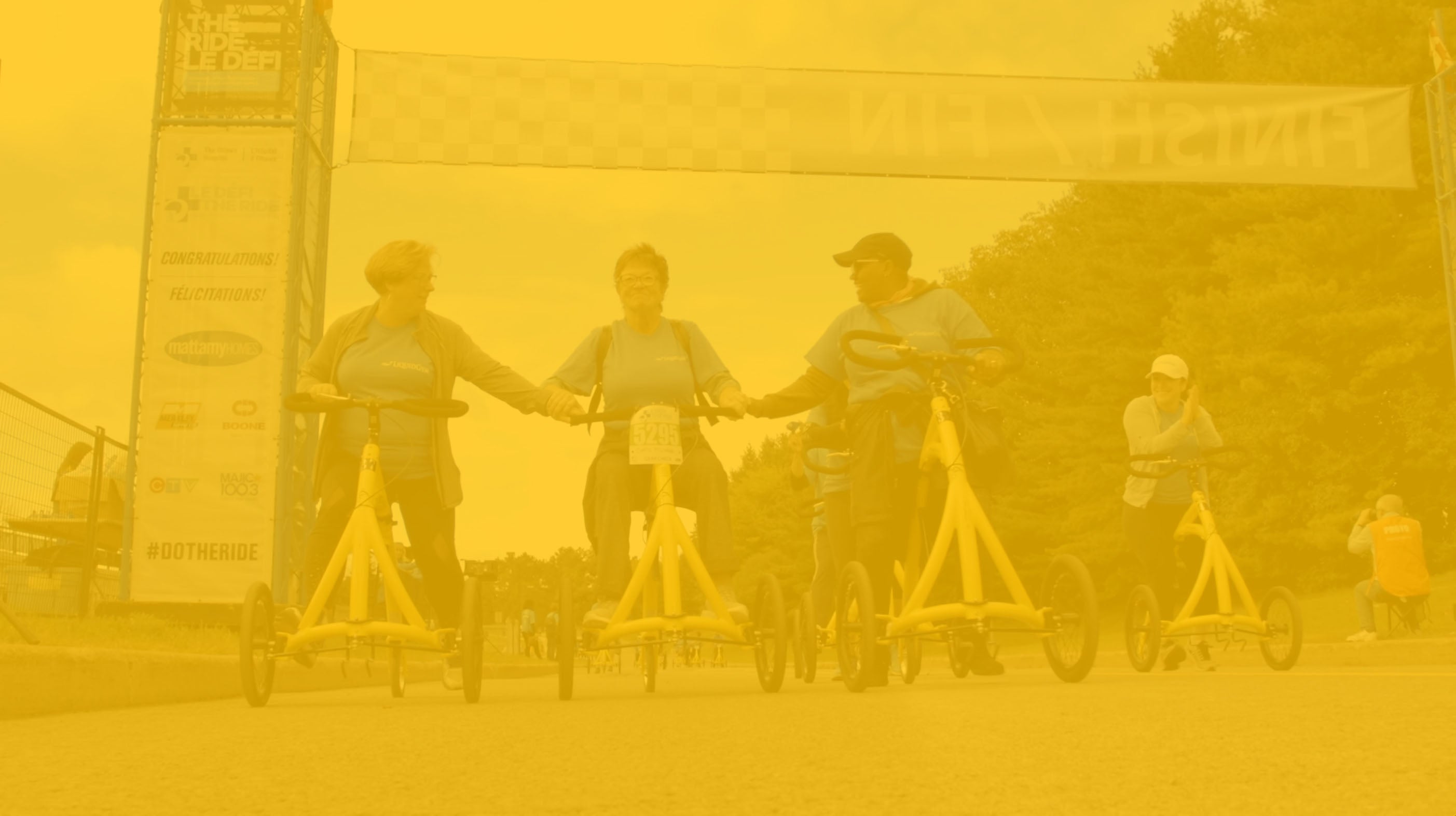 yellow background image of people riding the alinker