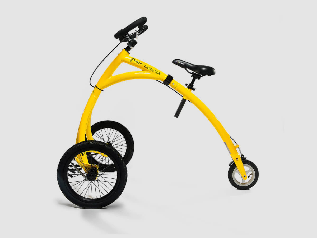The Alinker walking bike — bright yellow, three-wheeled